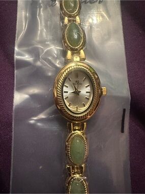 Gold-Tone Women’s Bracelet Watch with Green Stone Links